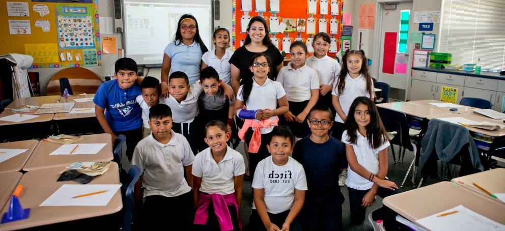 A teacher standing with her class